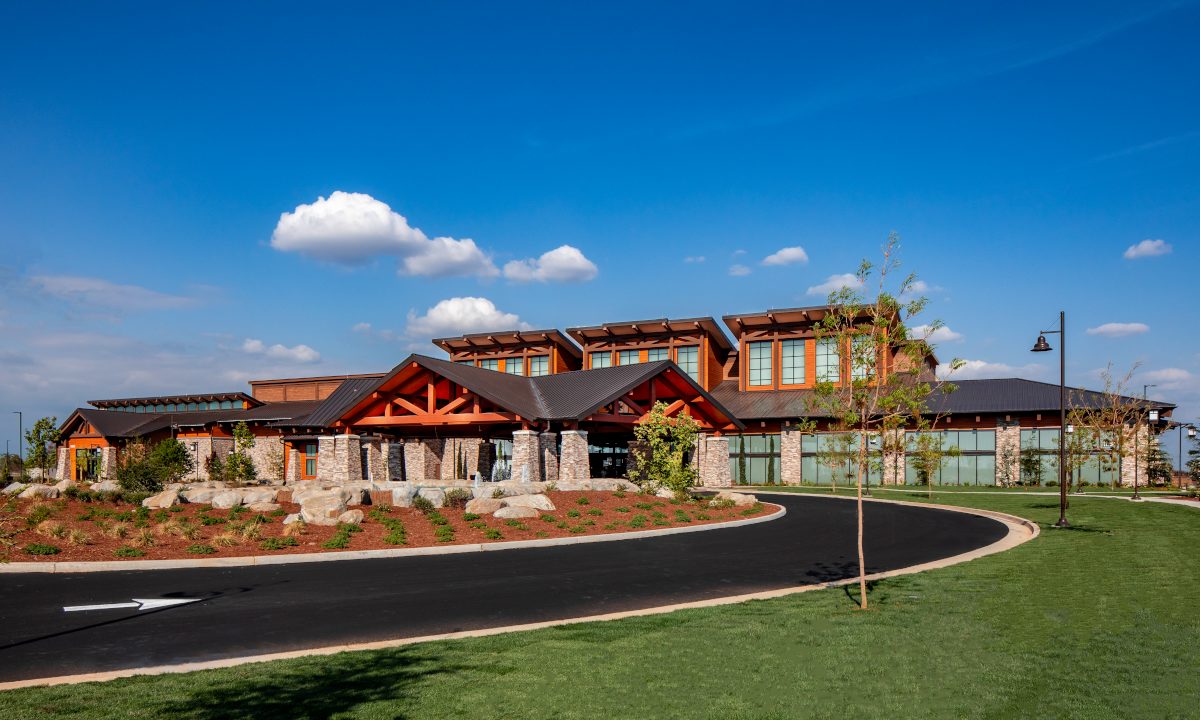 exterior of a large low-slung contemporary Craftsman style building