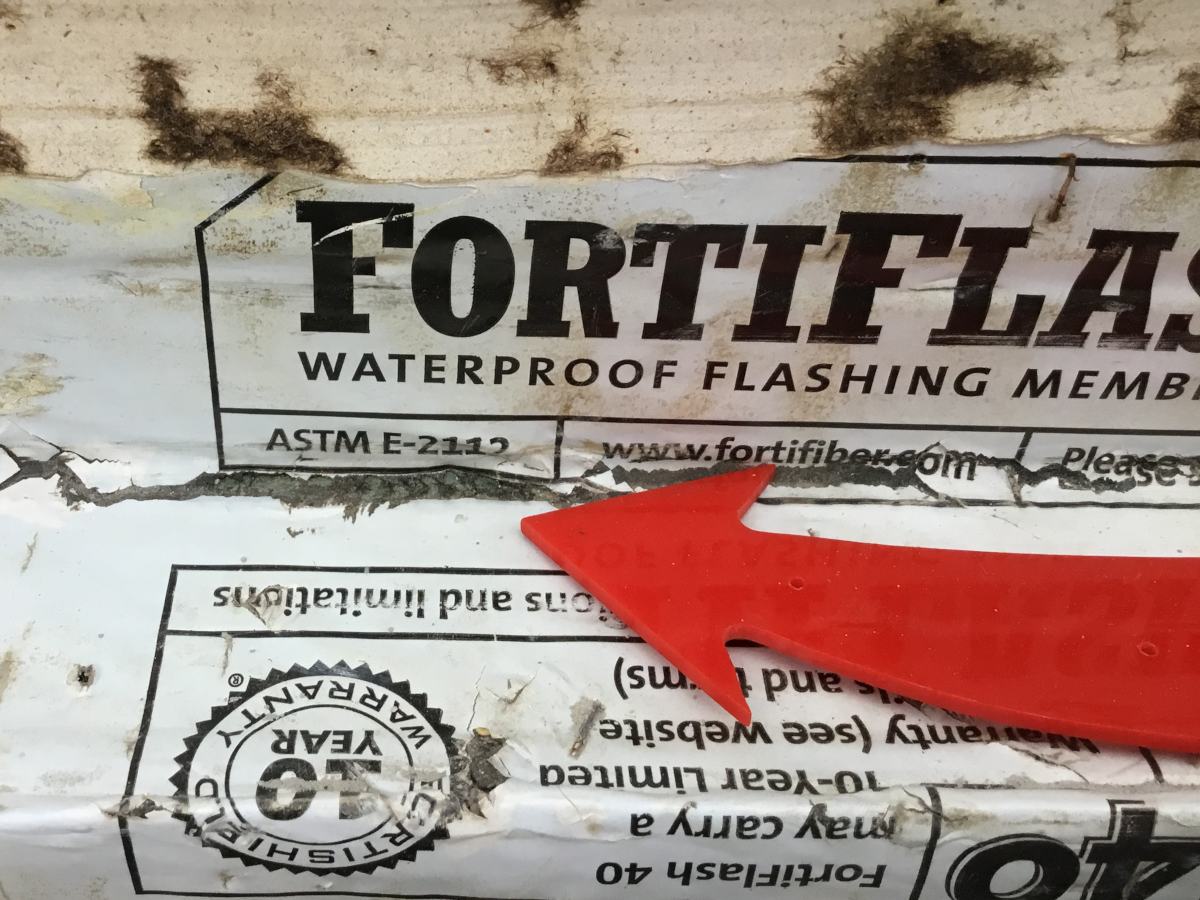 red arrow pointing to broken flashing